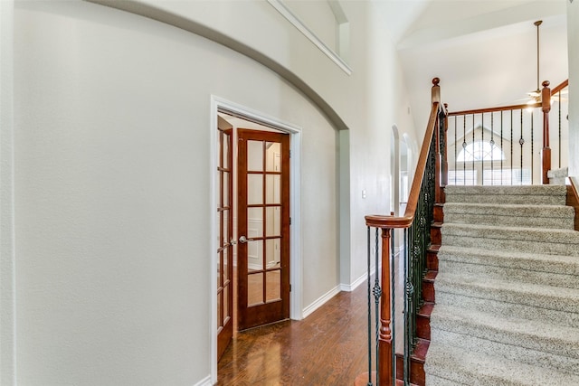 staircase featuring hardwood / wood-style flooring