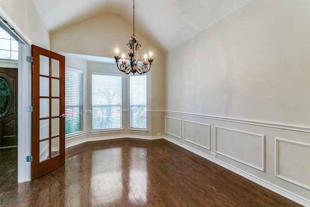 unfurnished dining area featuring an inviting chandelier, dark wood-type flooring, and vaulted ceiling