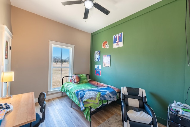 bedroom featuring ceiling fan and light hardwood / wood-style flooring