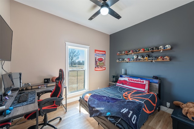 bedroom featuring ceiling fan and light wood-type flooring