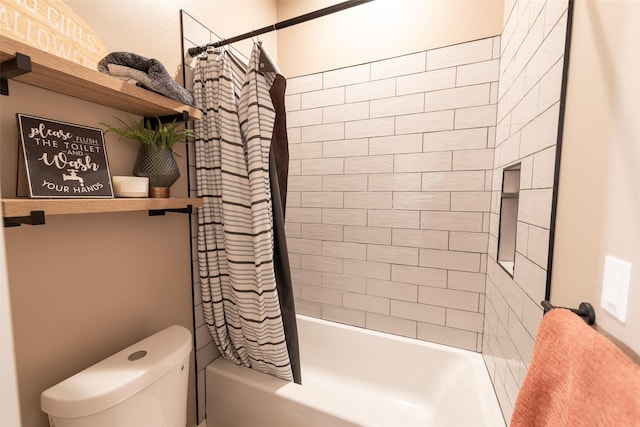 bathroom with shower / bath combo and toilet