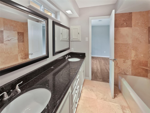 bathroom featuring tile patterned flooring and vanity