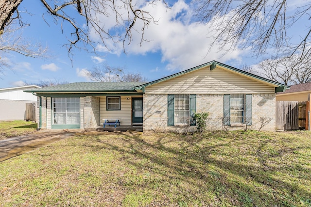 back of property featuring a yard