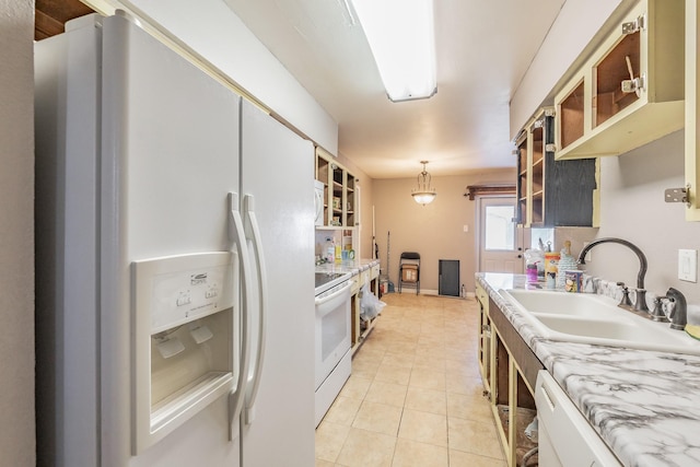 kitchen with hanging light fixtures, white cabinetry, sink, and white appliances