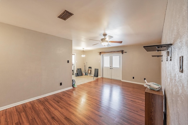 empty room featuring hardwood / wood-style floors and ceiling fan