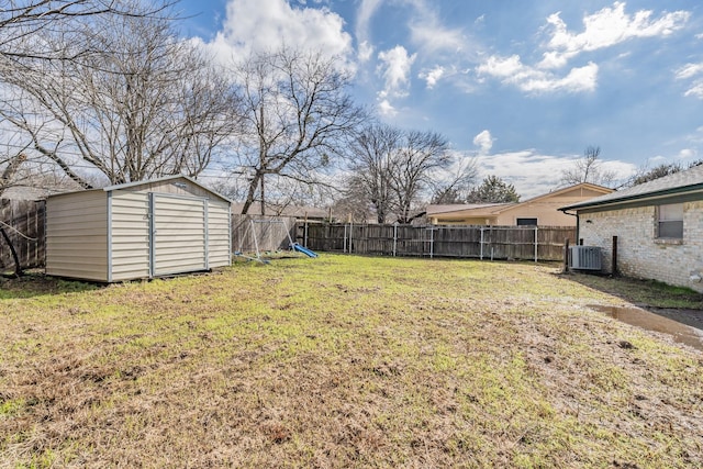 view of yard with a shed and central AC unit