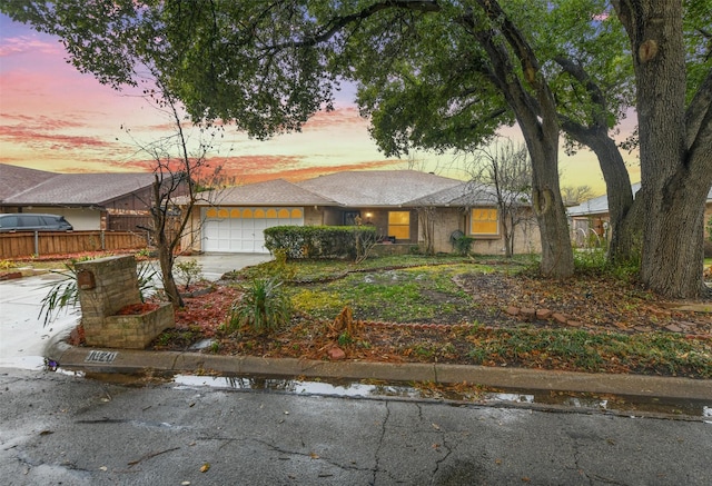 view of front of property with a garage