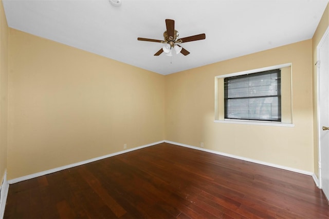 spare room featuring hardwood / wood-style flooring and ceiling fan