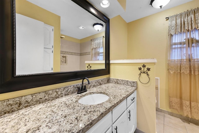 bathroom with vanity and tile patterned flooring