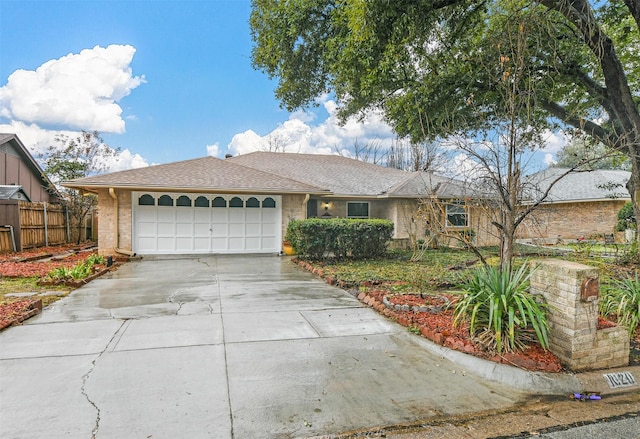 ranch-style house featuring a garage