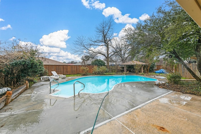 view of swimming pool featuring a gazebo and a patio