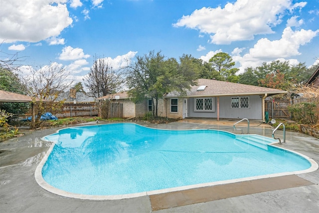 view of swimming pool with a patio area