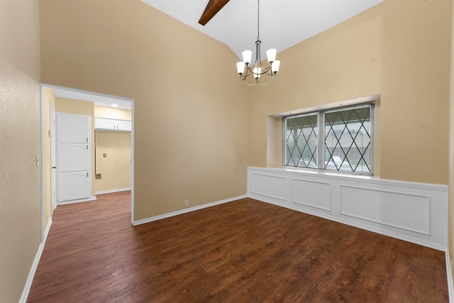 unfurnished room featuring a notable chandelier, high vaulted ceiling, and dark hardwood / wood-style floors