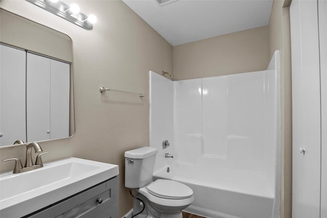 full bathroom with vanity, shower / washtub combination, and toilet