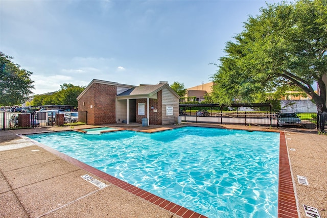 view of pool featuring a hot tub