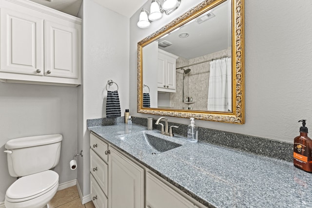 bathroom featuring a shower with curtain, tile patterned floors, toilet, and vanity