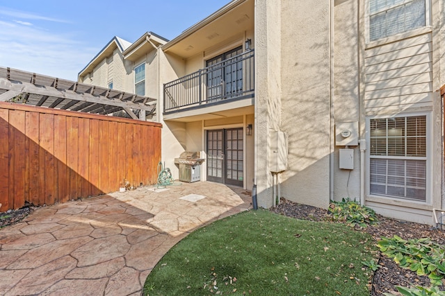 doorway to property with a patio