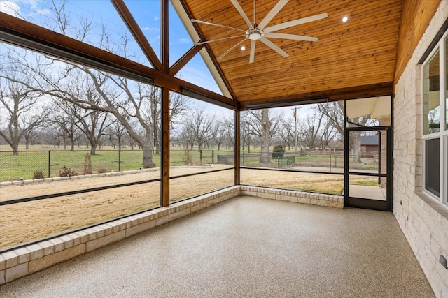 unfurnished sunroom featuring a rural view and wood ceiling