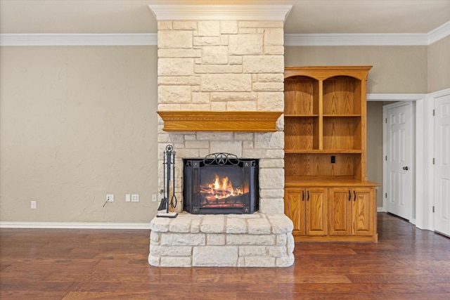 unfurnished living room featuring crown molding, dark hardwood / wood-style floors, and a stone fireplace