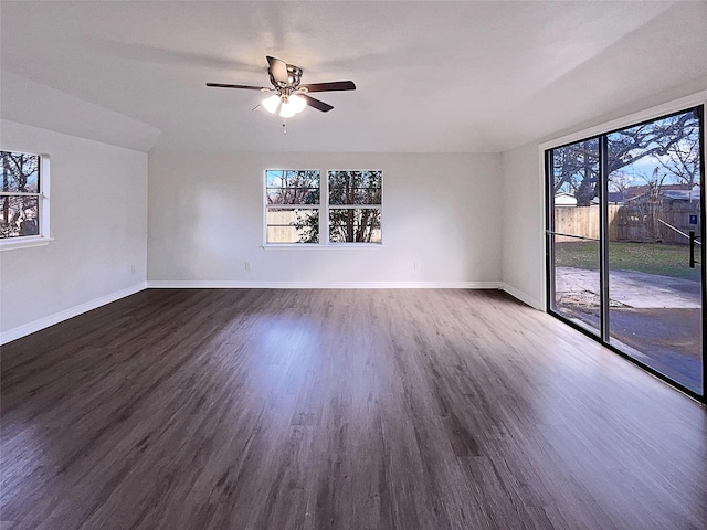 unfurnished room featuring dark hardwood / wood-style floors and ceiling fan