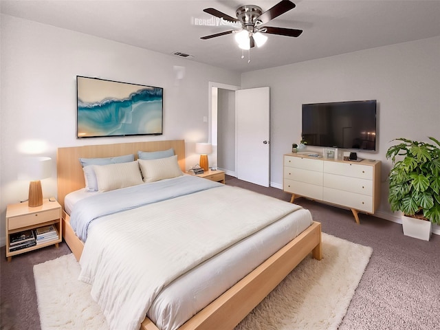 bedroom with ceiling fan and dark carpet