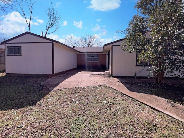 rear view of property featuring a patio area