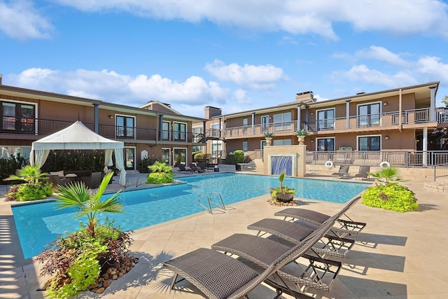 view of swimming pool featuring a gazebo and a patio area