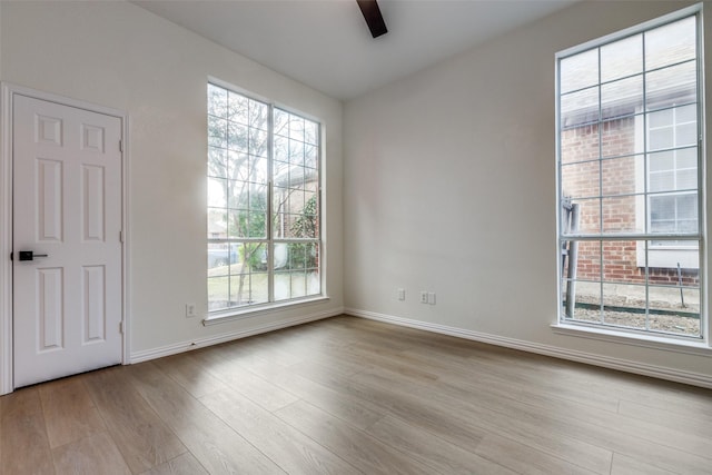 unfurnished room featuring ceiling fan and light hardwood / wood-style flooring