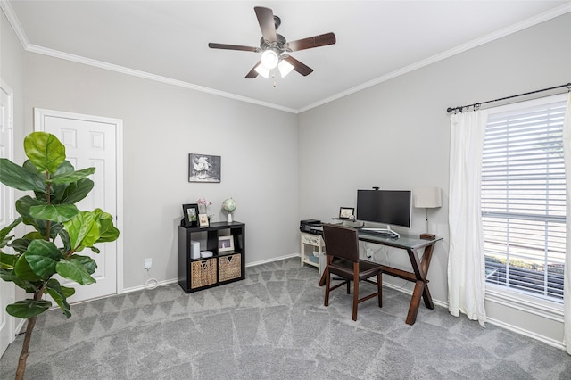 carpeted home office featuring crown molding and ceiling fan