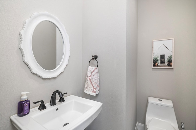 bathroom with sink and toilet