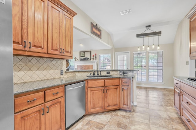 10121 Irish Ridge St, Forney, TX 75126 - kitchen with stainless steel dishwasher, a sink, backsplash, brown cabinets, and vaulted ceiling