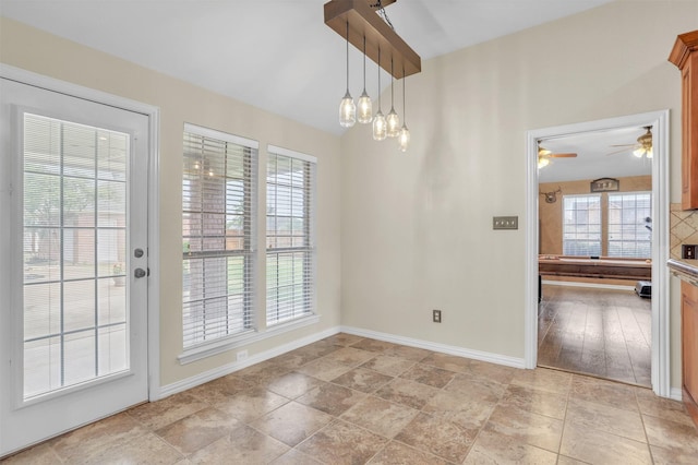 10121 Irish Ridge St, Forney, TX 75126 - unfurnished dining area with ceiling fan and baseboards