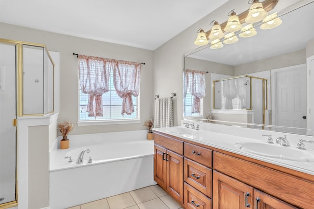 bathroom with vanity, plus walk in shower, tile patterned flooring, and a wealth of natural light