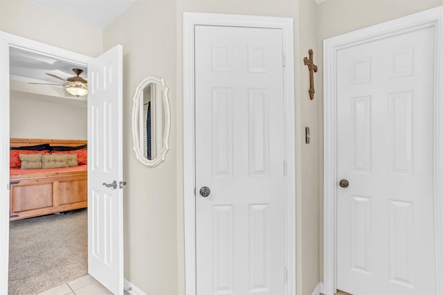 10121 Irish Ridge St, Forney, TX 75126 - hallway with light tile patterned flooring, baseboards, and light carpet