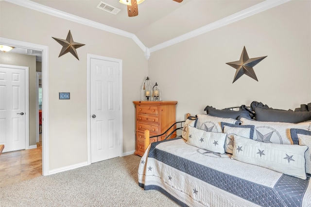 bedroom with crown molding, light colored carpet, ceiling fan, and vaulted ceiling