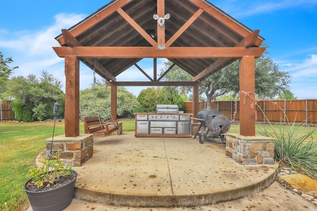 view of patio / terrace with area for grilling, a grill, and a gazebo