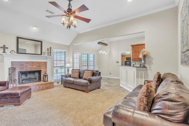 10121 Irish Ridge St, Forney, TX 75126 - living area with a ceiling fan, light carpet, a brick fireplace, vaulted ceiling, and ornamental molding