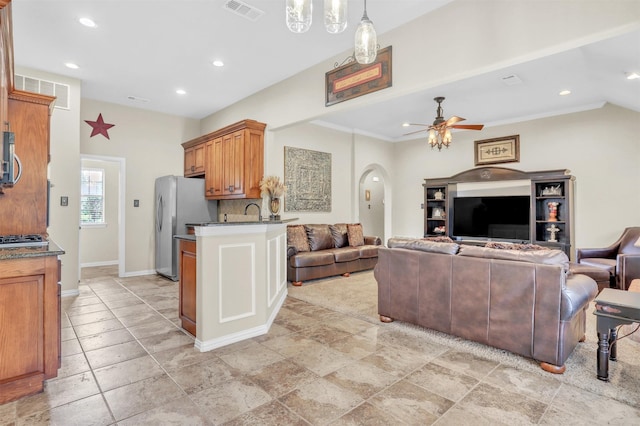 10121 Irish Ridge St, Forney, TX 75126 - living area featuring ceiling fan, arched walkways, recessed lighting, and baseboards