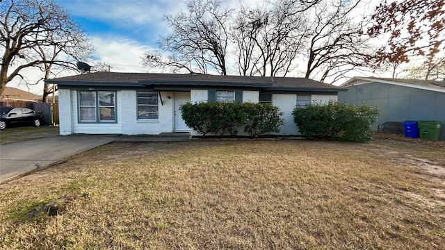 ranch-style house with a front lawn