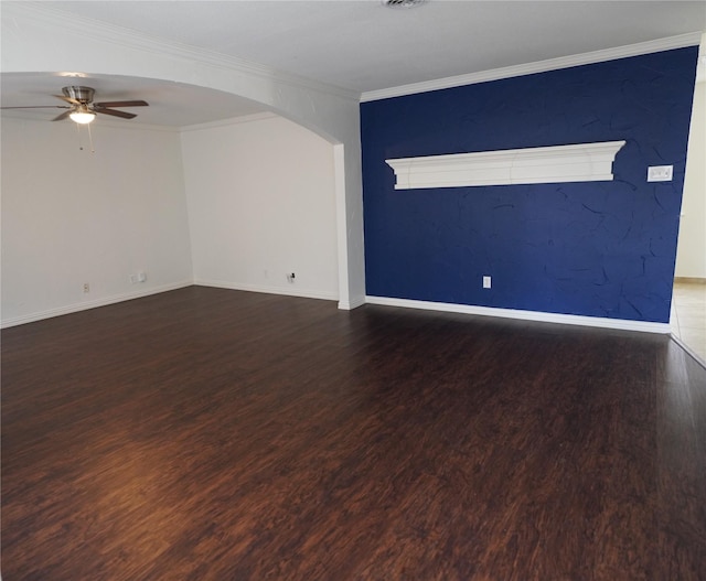 spare room with crown molding, dark hardwood / wood-style floors, and ceiling fan