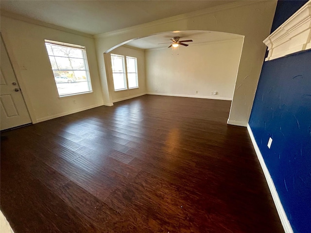 unfurnished living room with crown molding, ceiling fan, and dark hardwood / wood-style floors