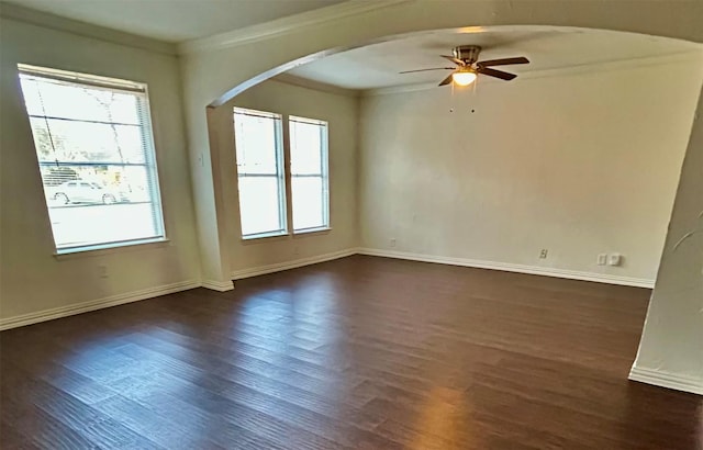 unfurnished room with dark hardwood / wood-style flooring, crown molding, and ceiling fan