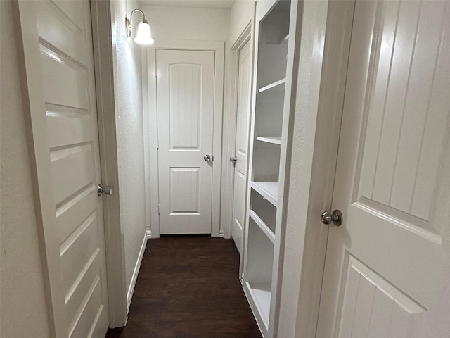 hall with dark hardwood / wood-style flooring