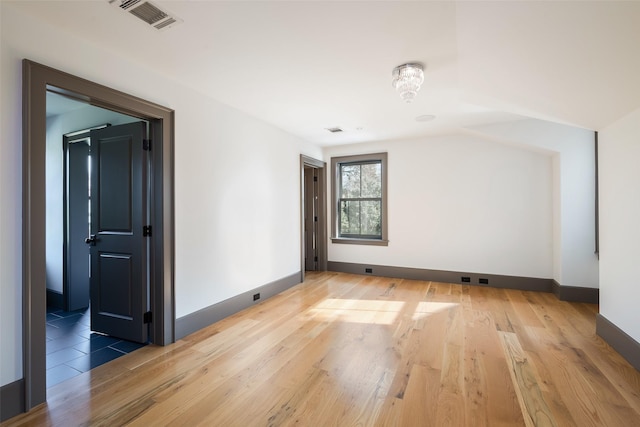 bonus room featuring hardwood / wood-style floors