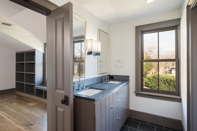 bathroom with vanity and hardwood / wood-style floors