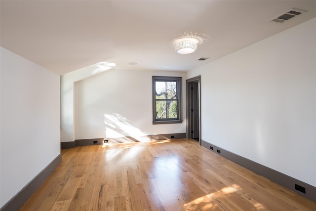 bonus room with light hardwood / wood-style flooring