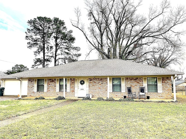 single story home with a garage and a front lawn