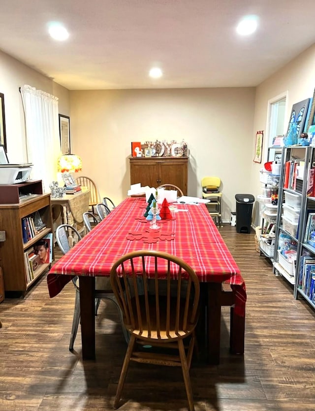 dining space with dark hardwood / wood-style floors