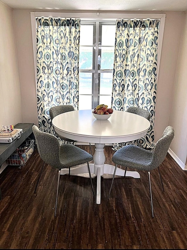 dining space with dark wood-type flooring