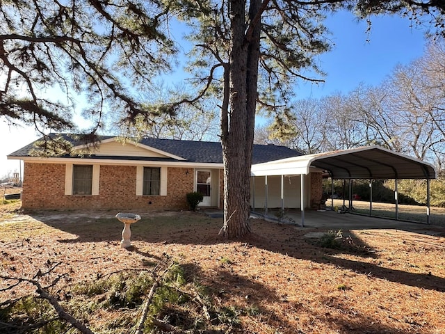 view of side of property featuring a carport